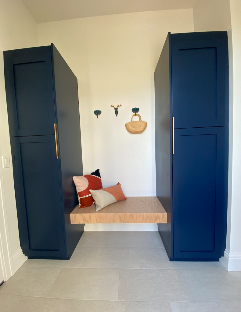 Ikea high cabinets with semi handmade doors and panels in mudroom